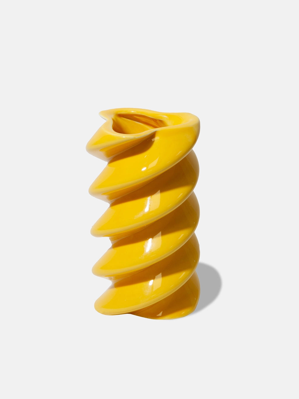 Yellow spiral-shaped object on a white background