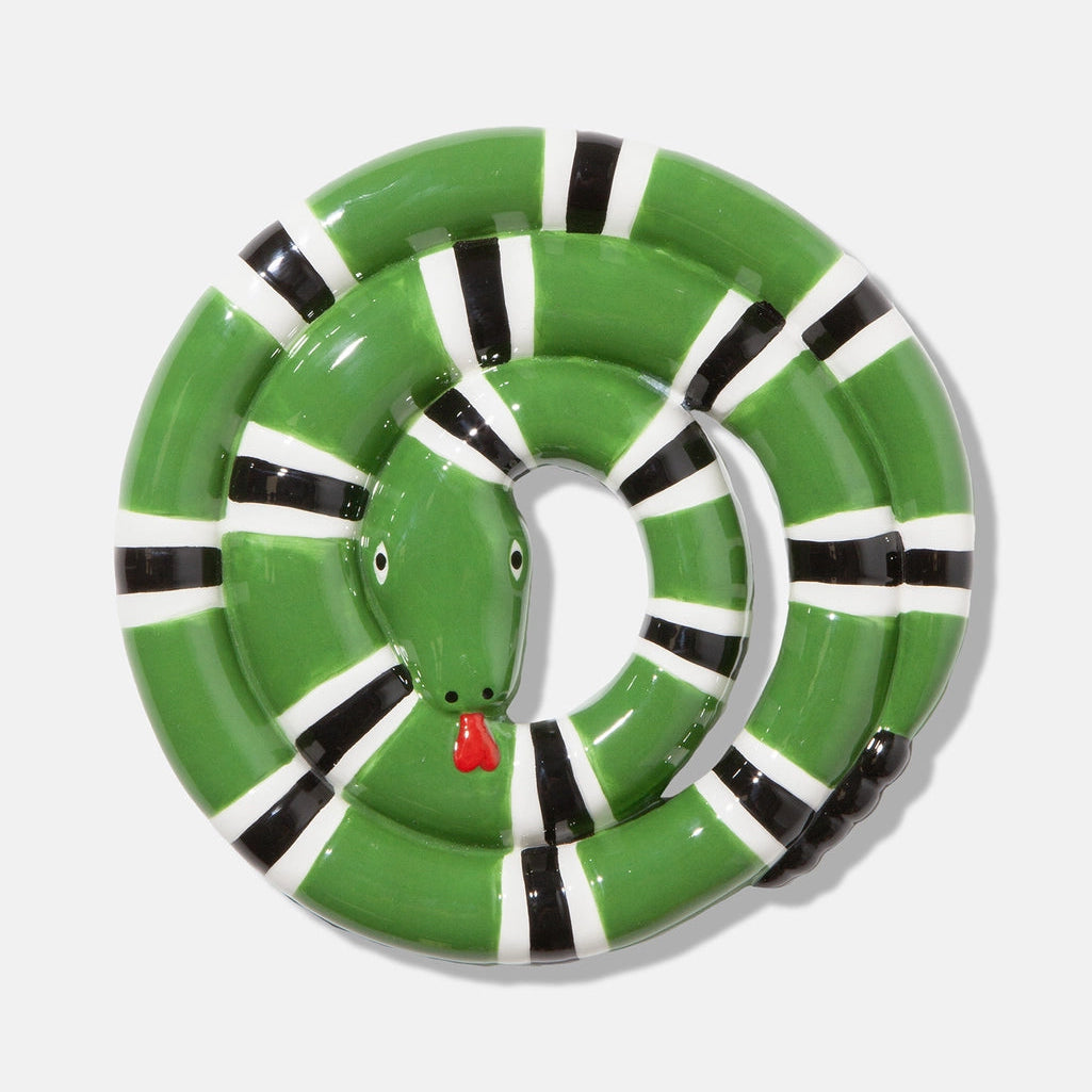 Green inflatable pool float shaped like a snake on a white background